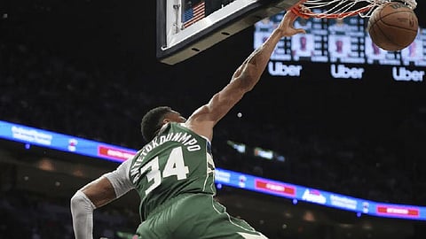 Giannis Leads Bucks to Overtime Victory Over Heat, Secures Playoff Spot
