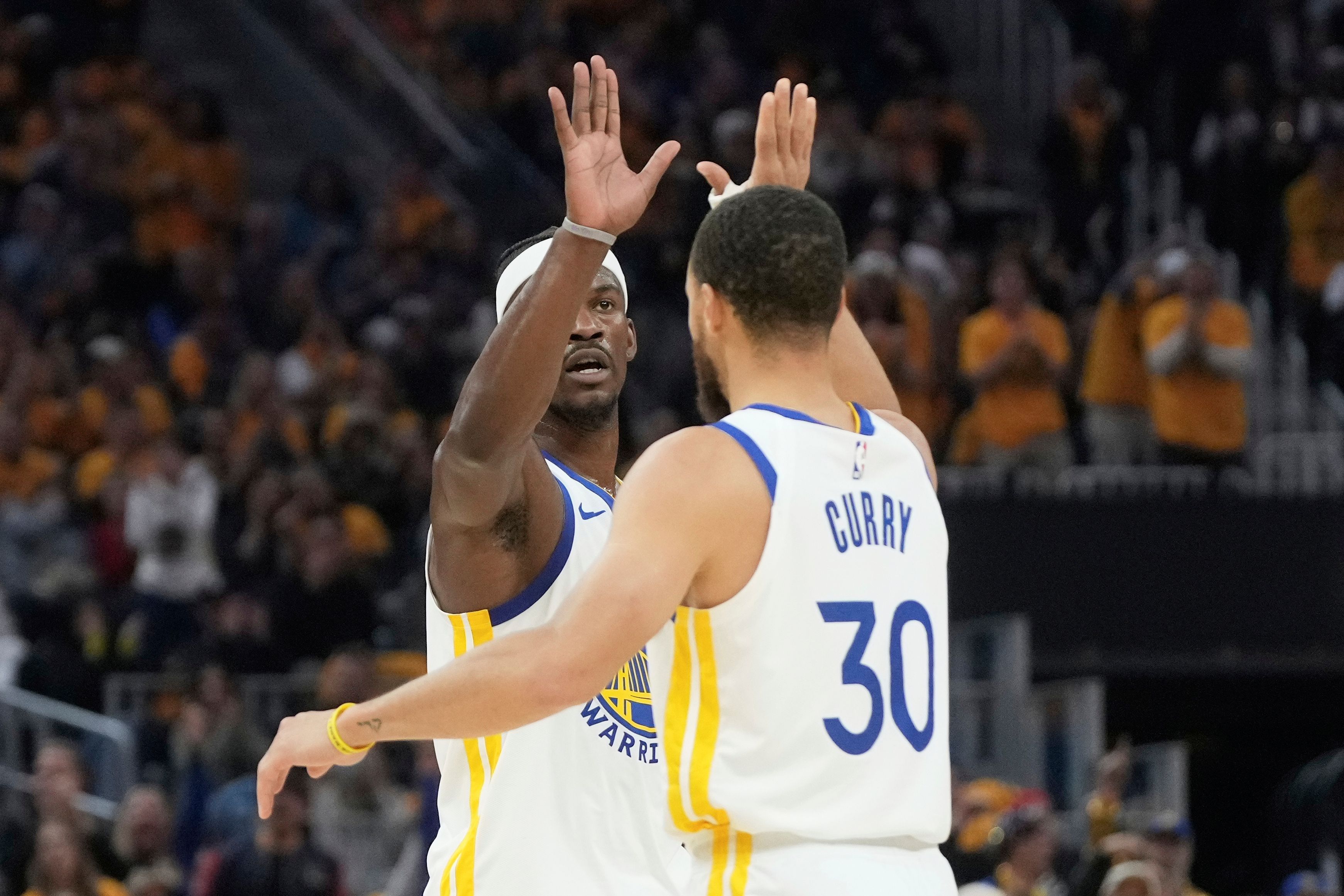 Butler and Curry's Dynamic Duo Propels Warriors to Playoff Victory Over Grizzlies